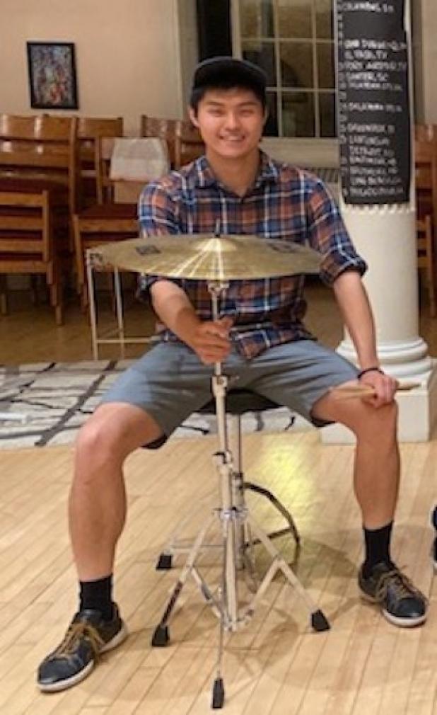 HST student sitting behind cymbal