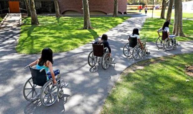 Able-bodied MIT students used wheelchairs to get around the Cambridge campus last week. Photo by David L. Ryan/Boston Globe.
