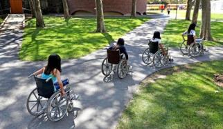 Able-bodied MIT students used wheelchairs to get around the Cambridge campus last week. Photo by David L. Ryan/Boston Globe.