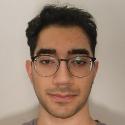headshot photo of PhD student Ramin Kahidi